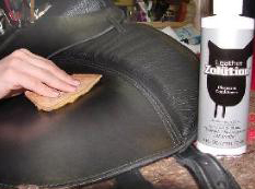 Applying leather conditioner to treeless saddle
